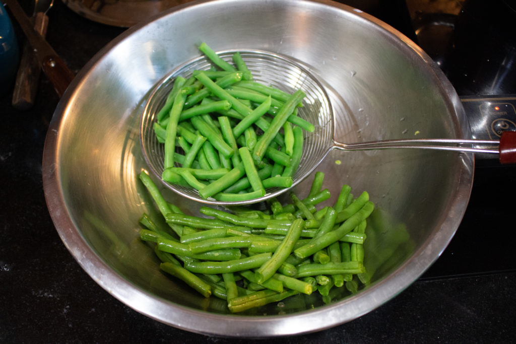 Use a spider skimmer to blanch vegetables like these green beans