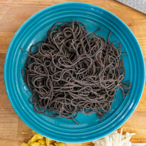 Toss the al dente noodles with sesame oil