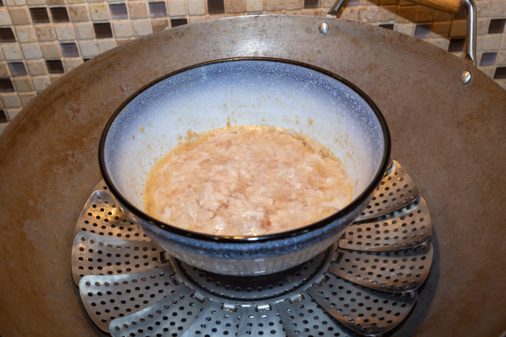 Steam the meat mixture for 6 minutes to form the bottom layer of steam water meat