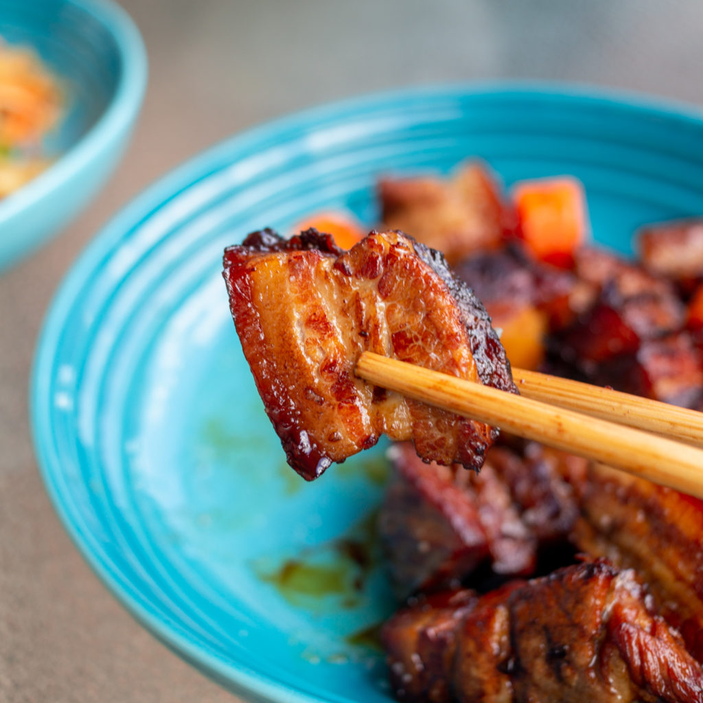 A tender, melty piece of red braised pork belly 红烧肉