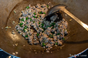 Saute ground pork with aromatics