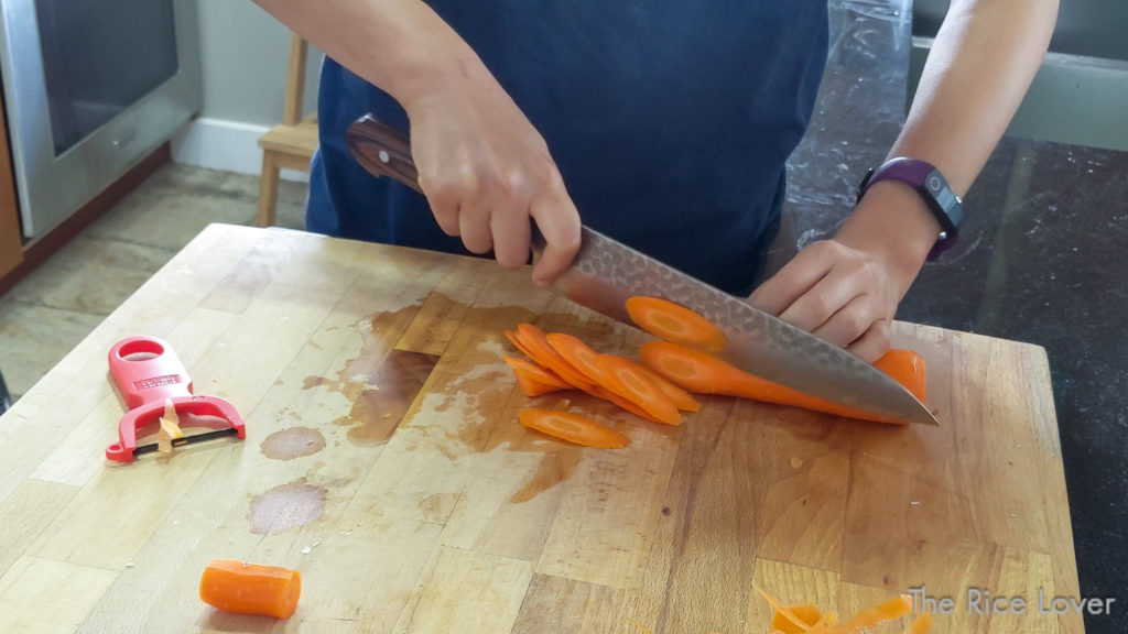 To julienne, first cut the carrot into rondelles (even slices) on the bias
