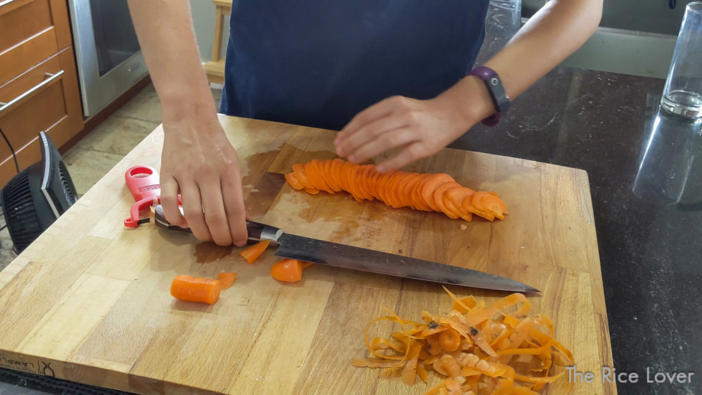 Fan out the carrot slices like a deck of cards to form an event, flat layer