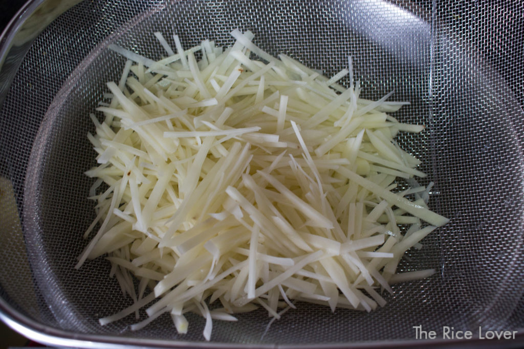 Julienne potatoes, with excess starch rinsed off