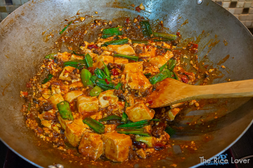 Mapo tofu with garlic scapes, finished and ready to plate