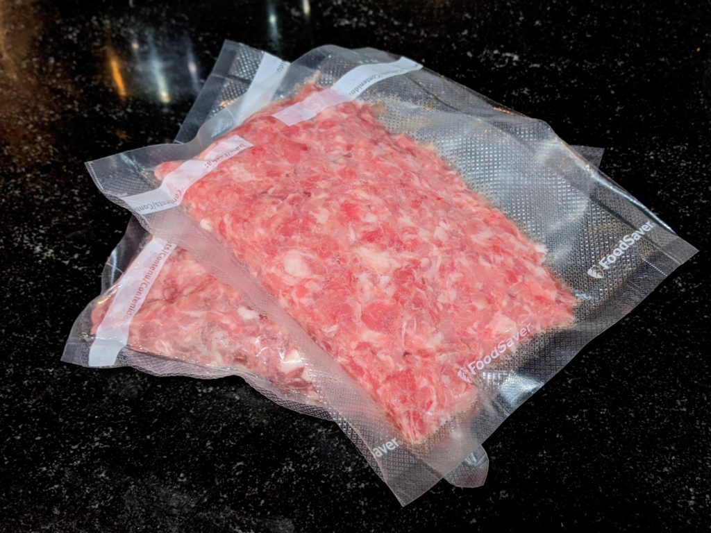 Portion, vacuum seal, and freeze ground meat