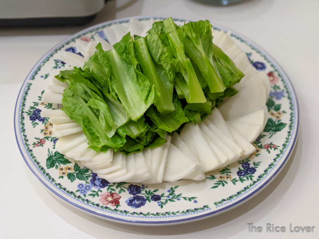 sliced daikon radish and celtuce leaves for hotpot party