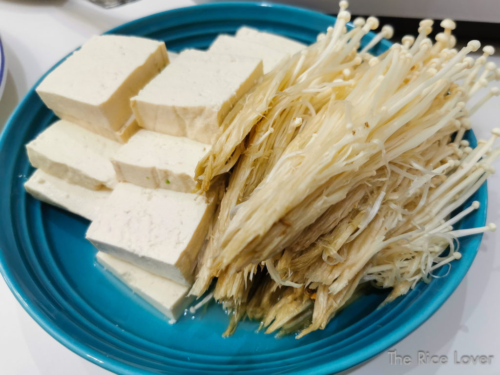 firm tofu and enoki mushrooms for hotpot party