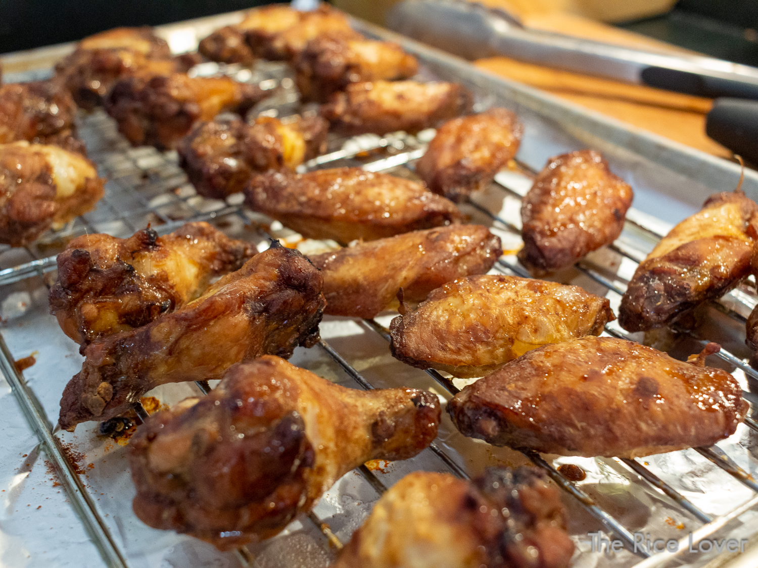 Crispy, freshly baked marinated chicken wings out of the convection oven